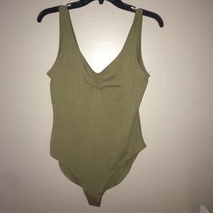 A green bodysuit